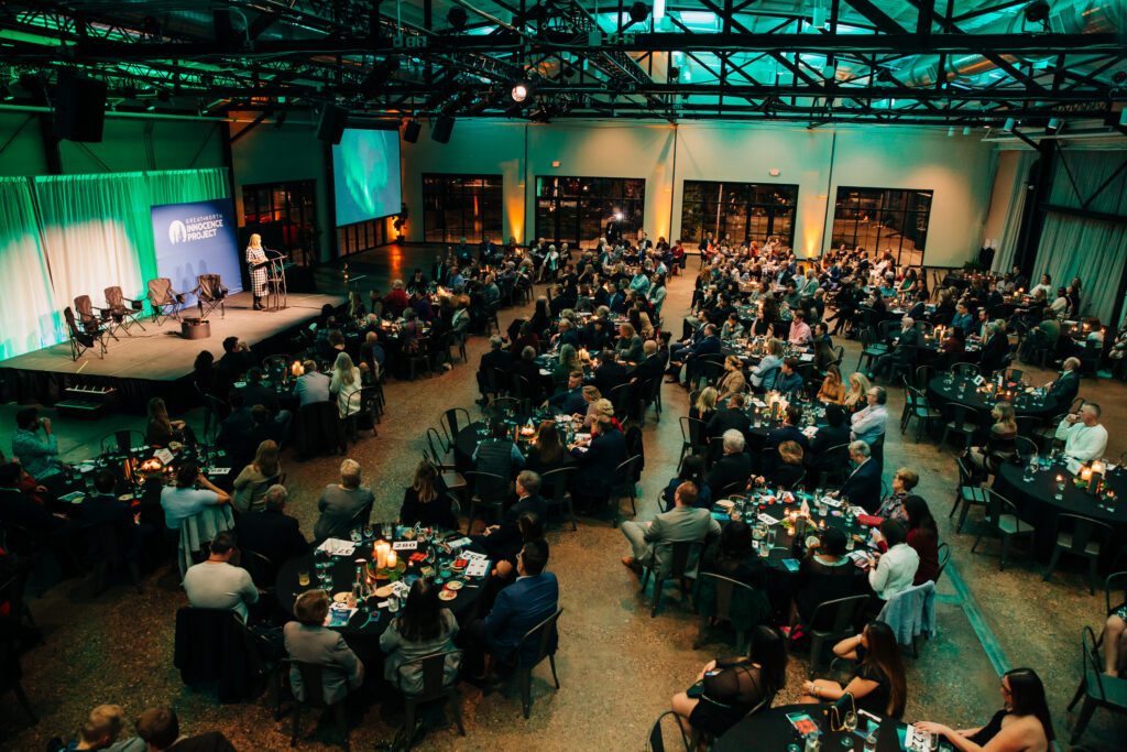 An event space packed with attendees
